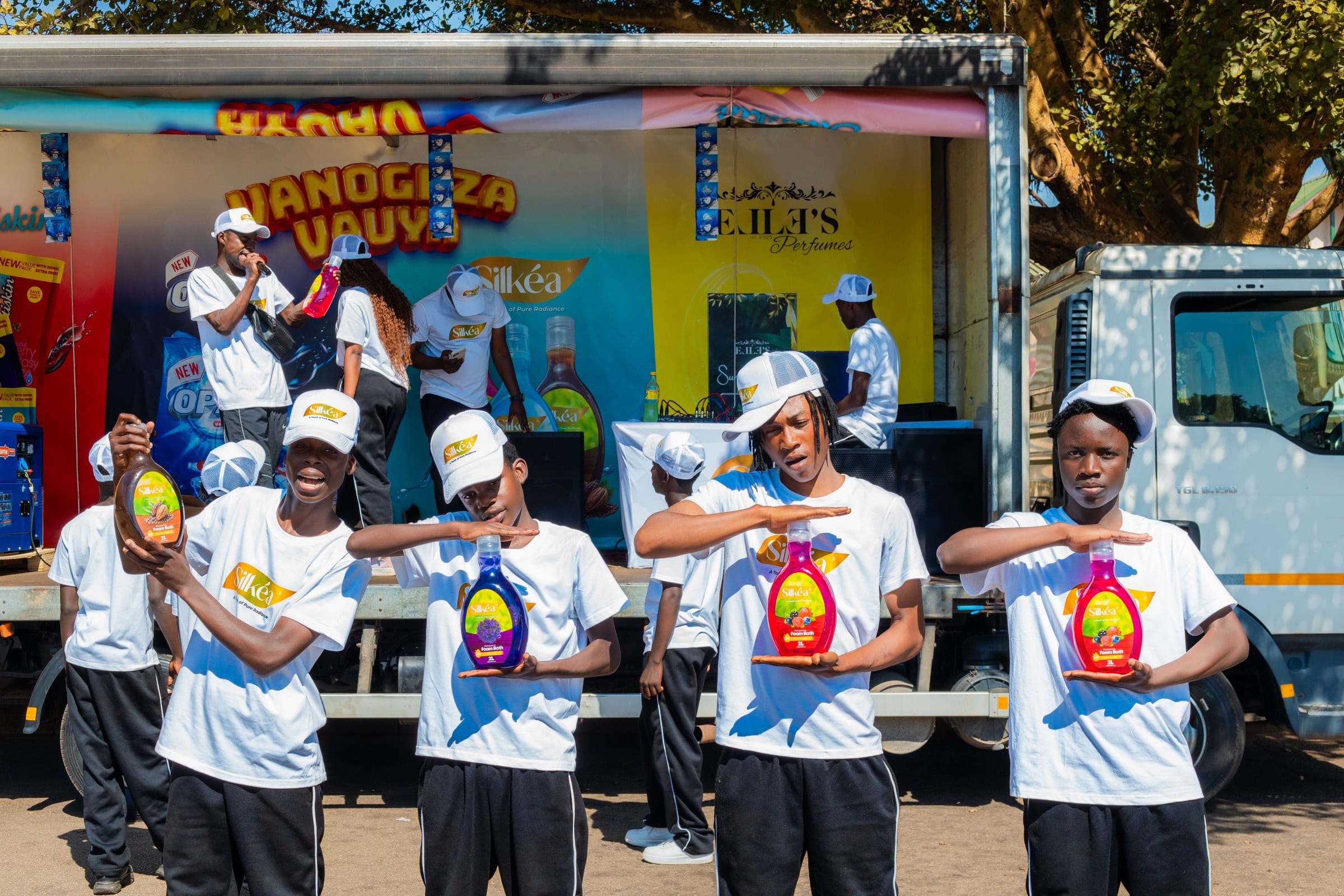 Promoters dancing with the product range at the roadshow