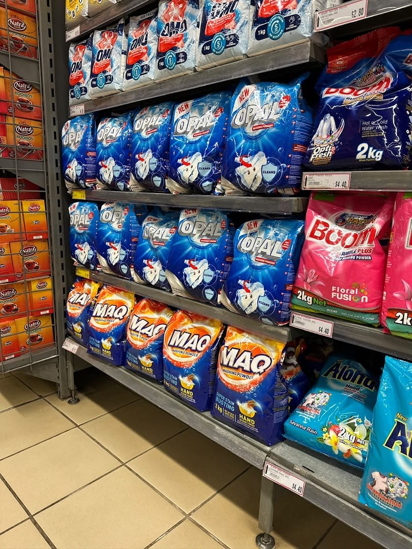 Opal packs merchandised across a supermarket laundry aisle