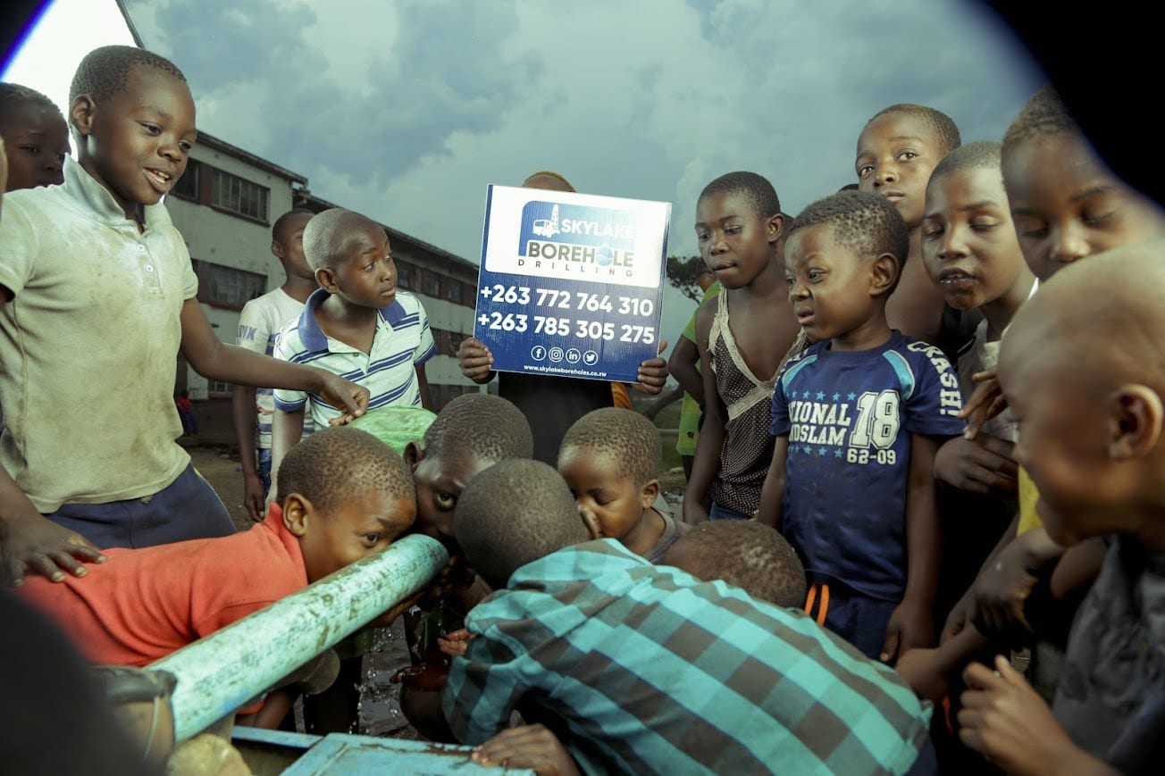 Children drinking from a newly drilled Skylake borehole